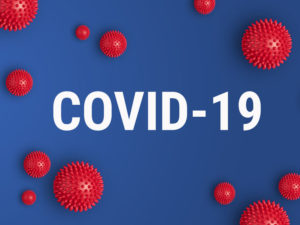 Inscription COVID-19 on blue background. World Health Organization WHO introduced new official name for Coronavirus disease named COVID-19