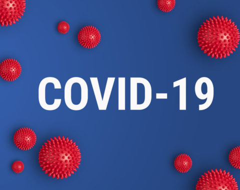 Inscription COVID-19 on blue background. World Health Organization WHO introduced new official name for Coronavirus disease named COVID-19